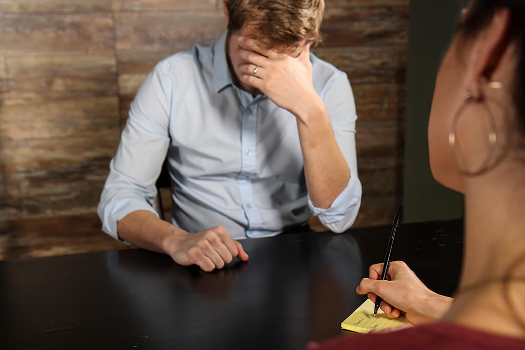 Two people in a counseling meeting