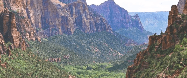 A valley between two tall structures of rock