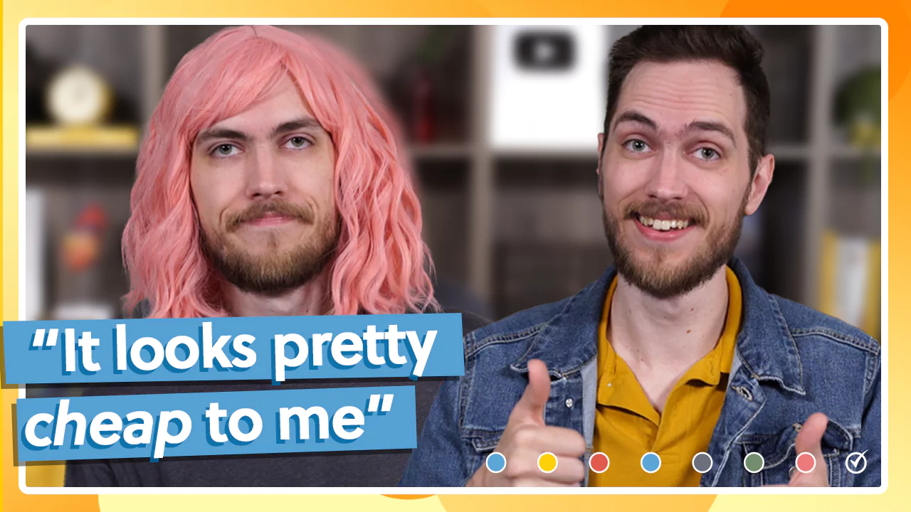 Two men are shown side by side. The man on the left has a pink wig and a neutral expression, with the text "It looks pretty cheap to me." The man on the right smiles and gives a thumbs-up.